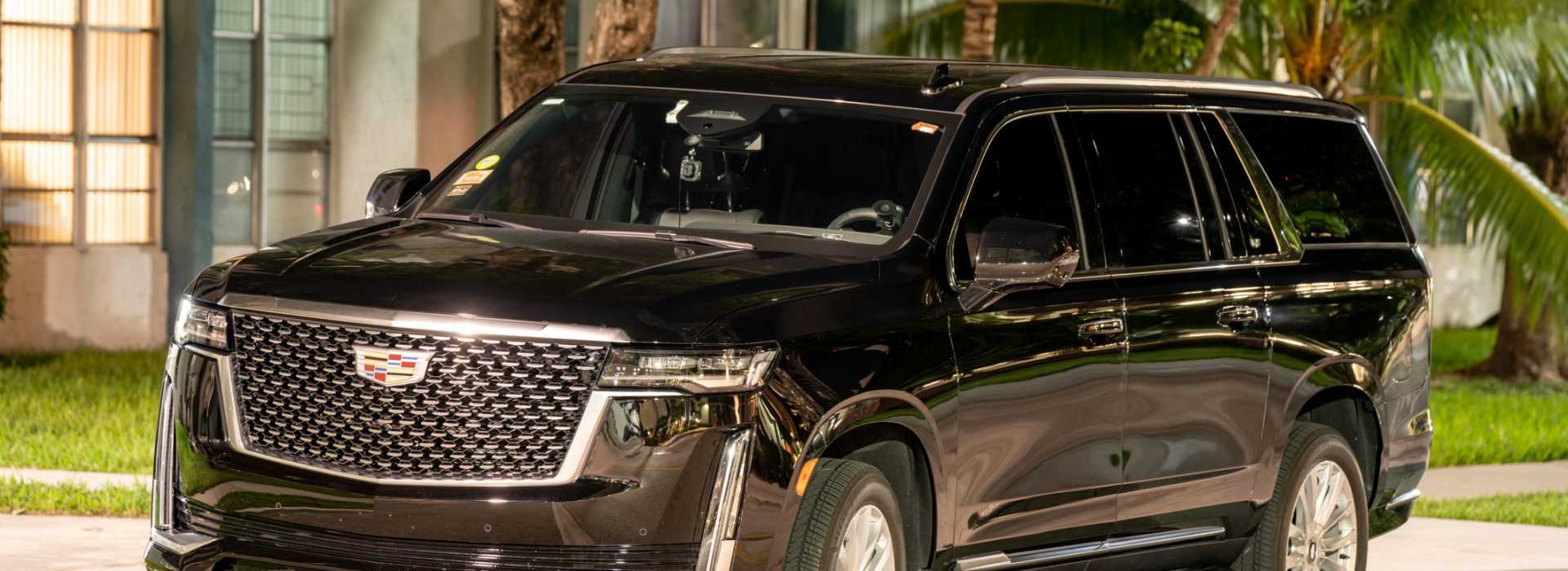 Sunny Isles Beach, FL, USA - October 21, 2021: Night photo of a Cadillac Escalade luxury suv limo used for Uber and Lyft